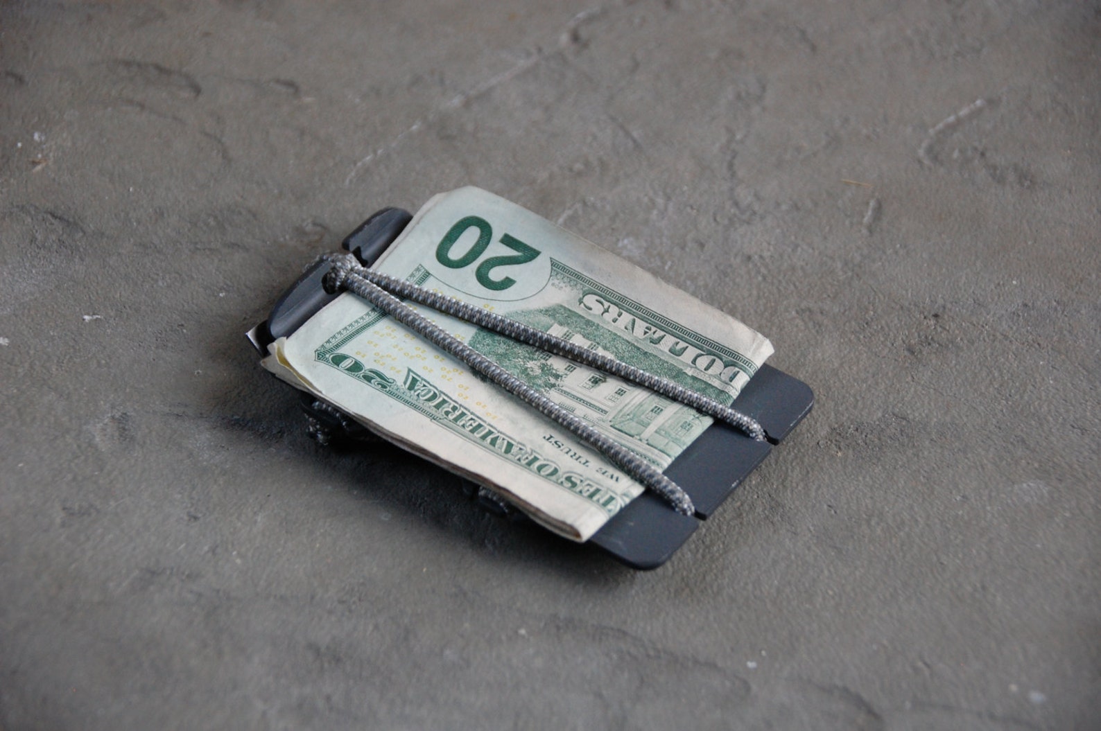 Cache Tool with cash on concrete